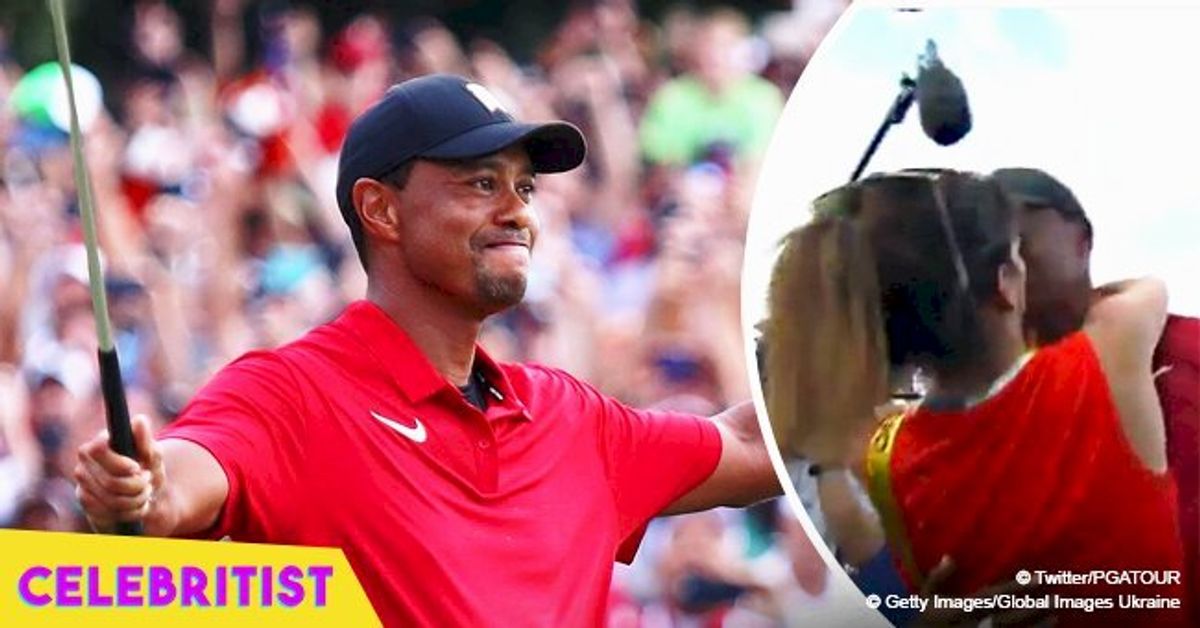 Tiger Woods celebrates his first win in five years with a kiss from ...