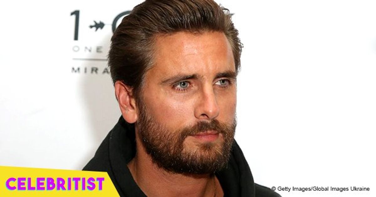 Scott Disick snuggles up to mystery blonde girl during Kanye's album