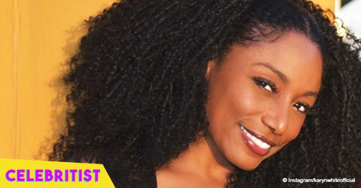 ‘Superwoman’ singer Karyn White looks ageless in plunging plaid flannel